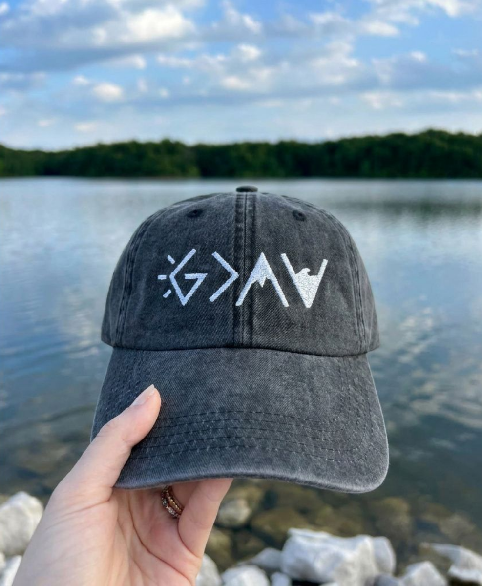 God is greater than the highs and lows symbol embroidered on vintage washed black dad hat
